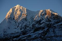 25 Phurbi Chyachu North Face Sunrise From Valley junction To Kong Tso Above Drakpochen The first rays of sunrise silhouette the north face of Phurbi Chyachu (6637m) from the valley junction to Kong Tso above Drakpochen.